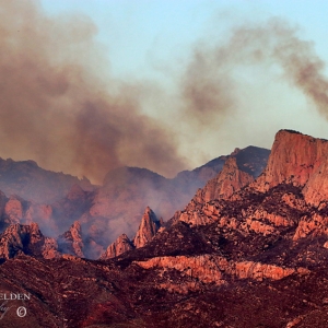Black clouds of smoke from the Big Horn Fire sicken the sky above the Santa Catalina Mountains in Arizona.
