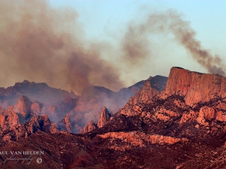 Black clouds of smoke from the Big Horn Fire sicken the sky above the Santa Catalina Mountains in Arizona.